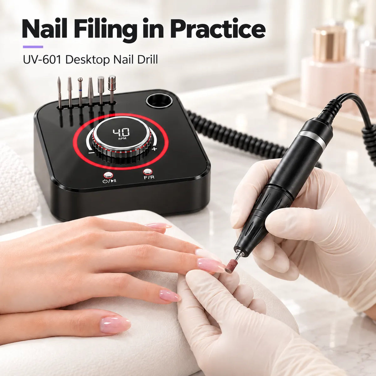Nail technician using the Wellstry UV-601 desktop nail drill during a salon filing service