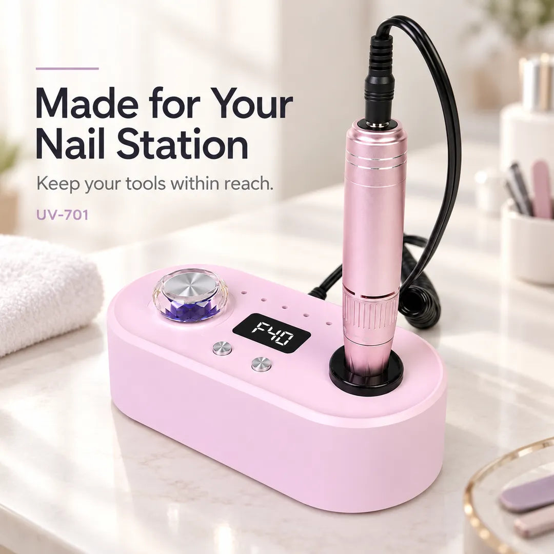 Wellstry UV-701 pink nail drill at a professional nail workstation